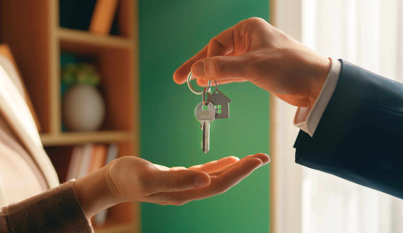 Handing over first apartment keys to someone