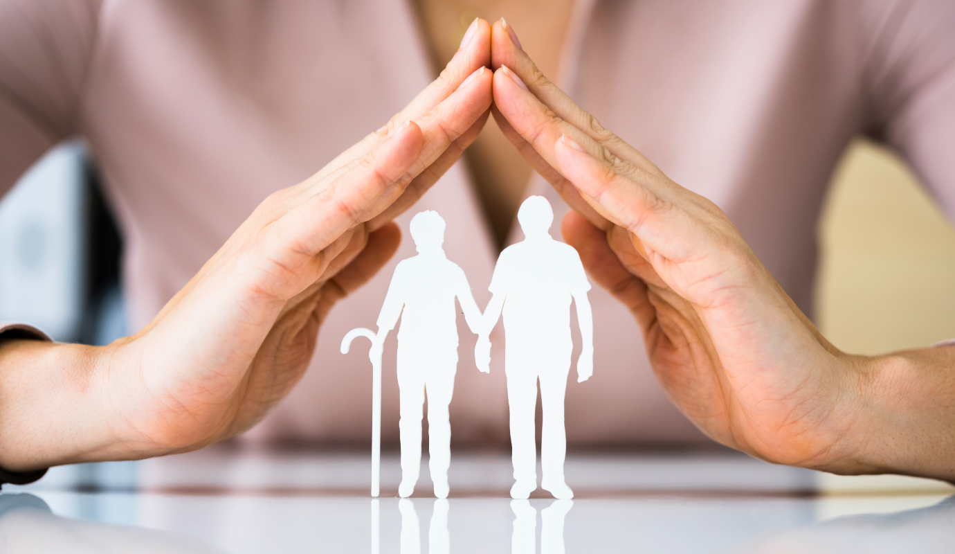 Image showing hands as roof above old couple showcasing the Dutch Pension System.